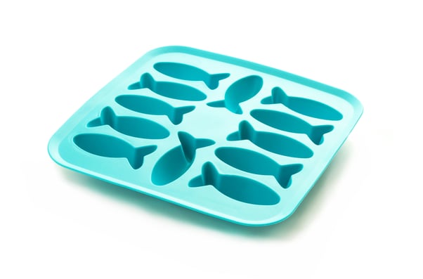 Blue silicone fish shape ice cube mould.
