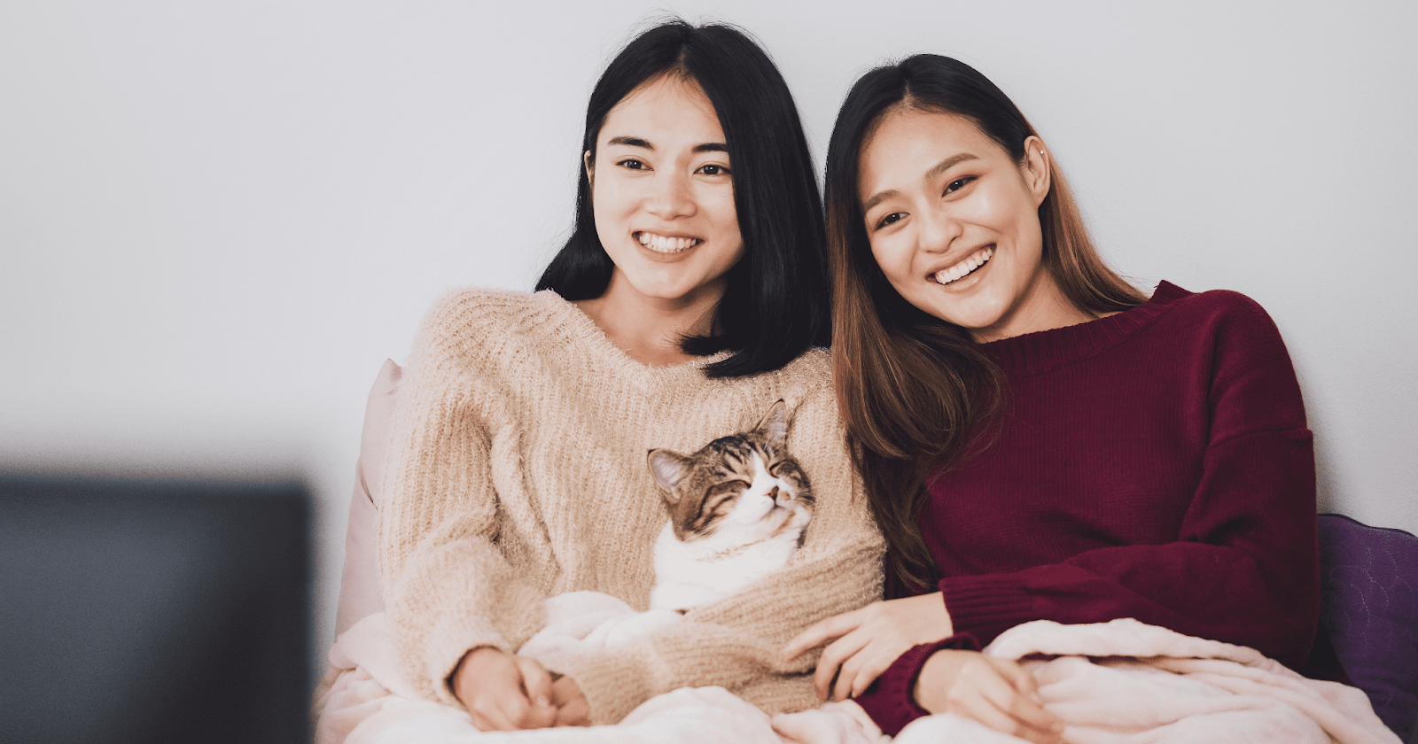 ladies with cat on sofa